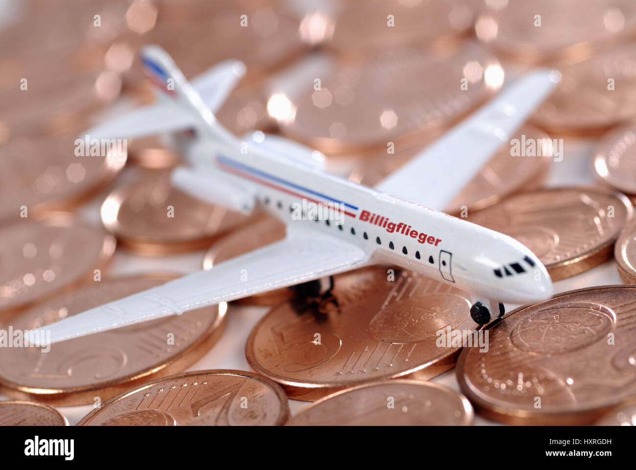 Miniature airplane on cent coins, cheap Airlines, Miniaturflugzeug auf Cent-Münzen, Billig-Airlines Stock Photo