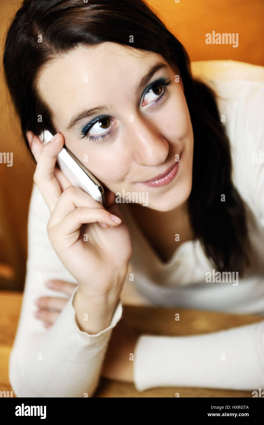 Woman calls up mobile phone, Frau telefoniert mit Handy Stock Photo