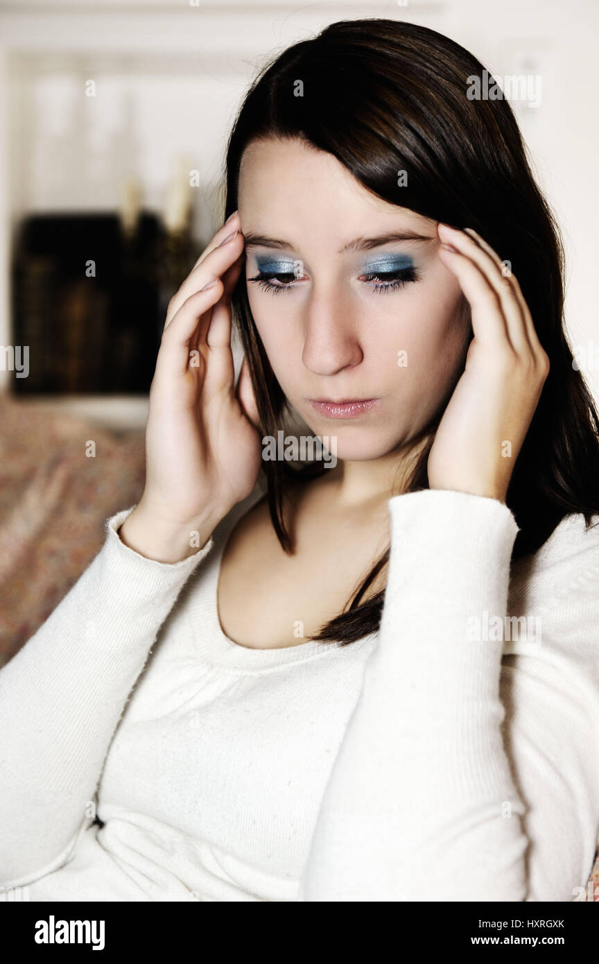 Young woman has headaches, Junge Frau hat Kopfschmerzen Stock Photo