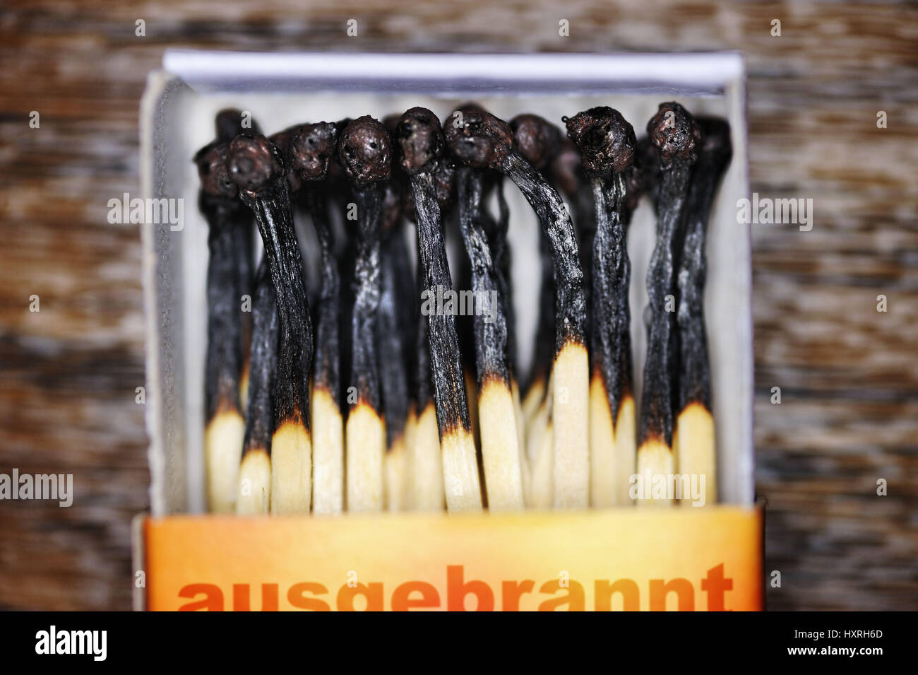 Match box with burnt down matches, borer out syndrome, Streichholzschachtel mit abgebrannten Streichhölzern, Burnout-Syndrom Stock Photo