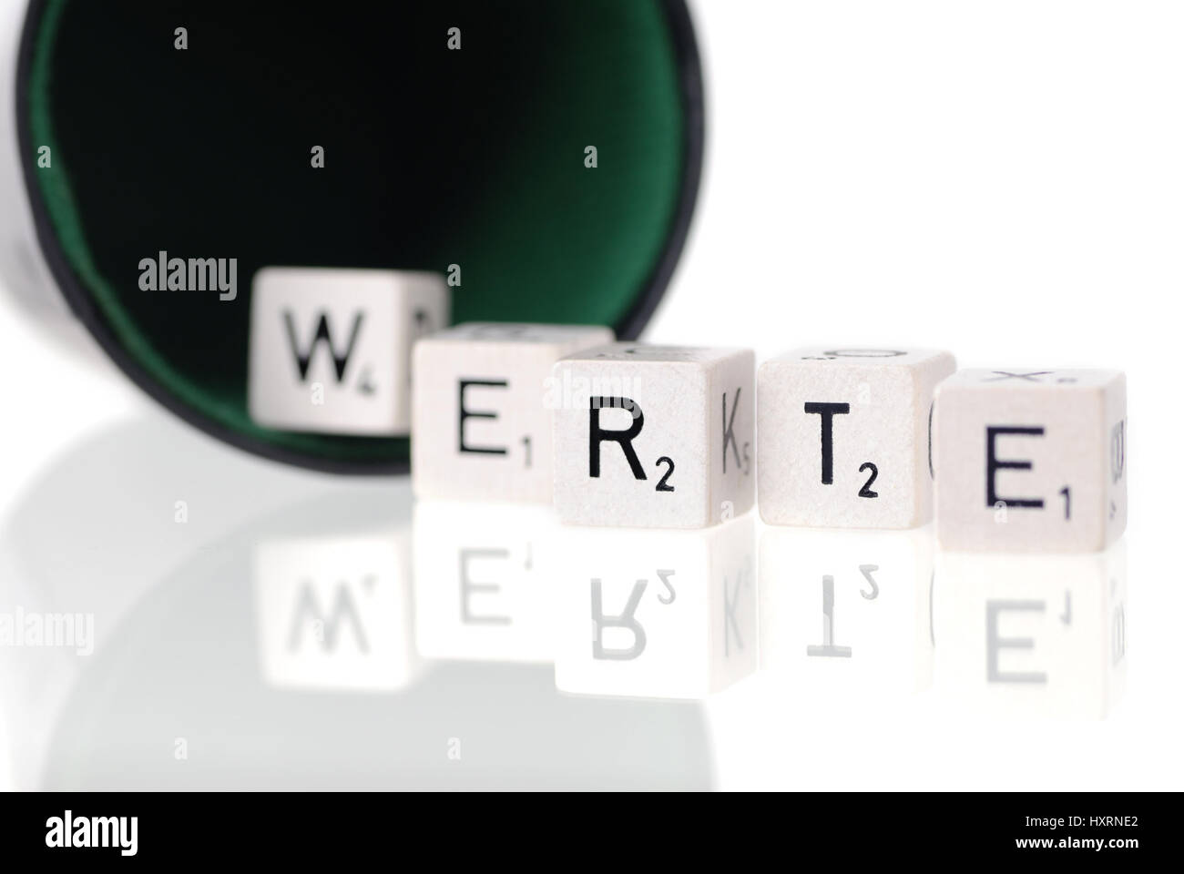 Dice cup with letter cube, stroke values, Würfelbecher mit Buchstabenwürfel, Schriftzug Werte Stock Photo