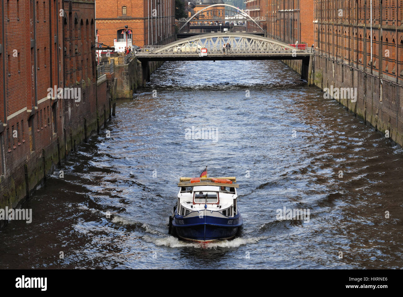 Longboat on a canal in the memory town in Hamburg, Germany, Europe, Barkasse auf einem Fleet in der Speicherstadt in Hamburg, Deutschland, Europa Stock Photo