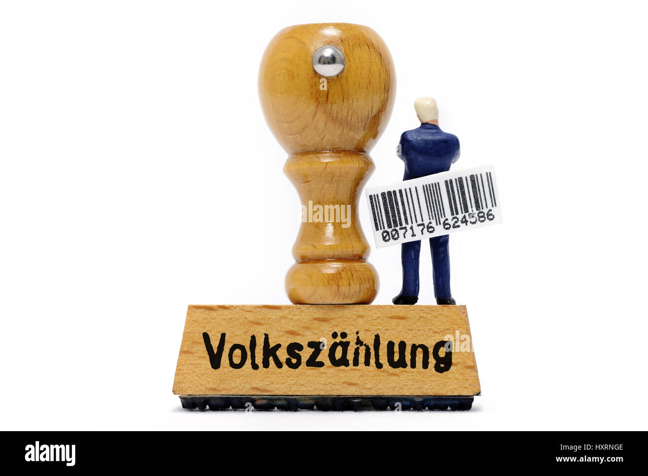Miniature figure with bar code on a stamp with the stroke census, Miniaturfigur mit Strichcode auf einem Stempel mit dem Schriftzug Volkszählung Stock Photo