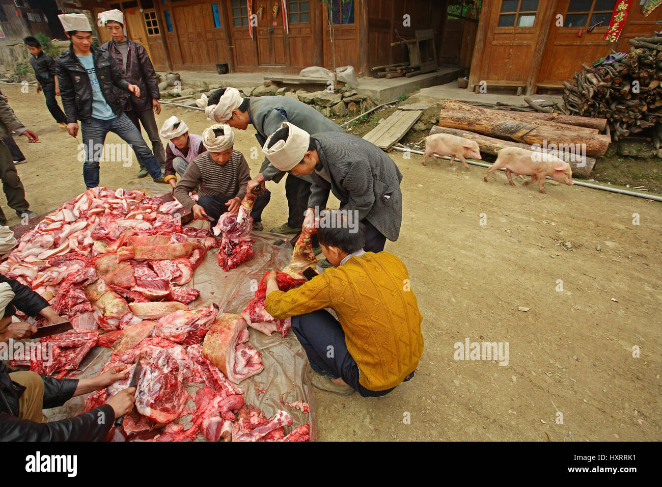 Zengchong village, Guizhou, China - April 12, 2010: Processing of fresh pork, Chinese peasants from the village of ethnic minorities Zengchong Dong Vi Stock Photo