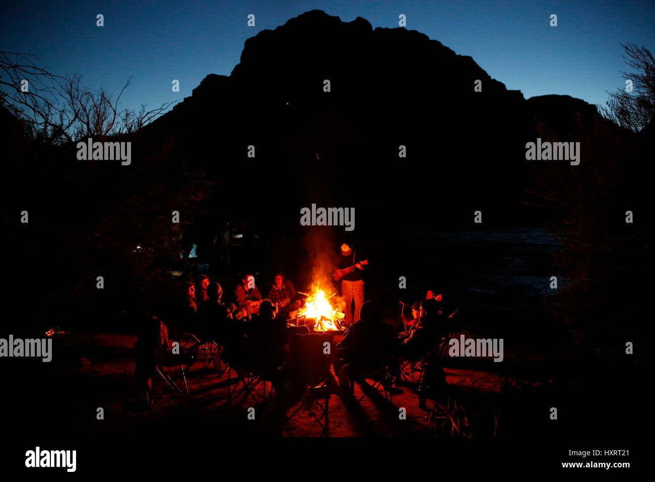 Rafters around a campfire in Grand Canyon National Park, Arizona, United States. Stock Photo