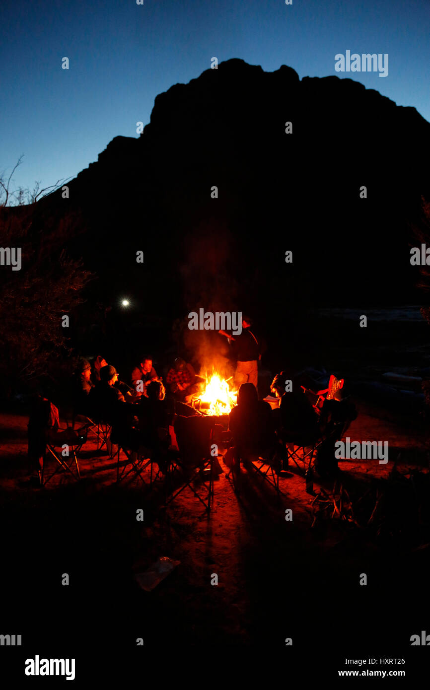 Rafters around a campfire in Grand Canyon National Park, Arizona, United States. Stock Photo