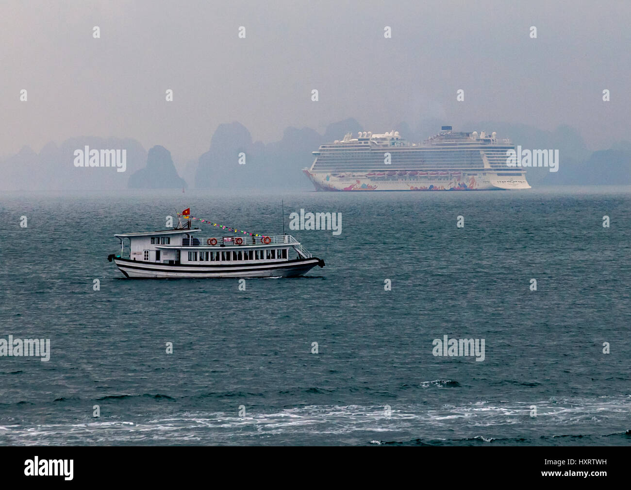 Cruise ship leaving Ha Long Bay Stock Photo
