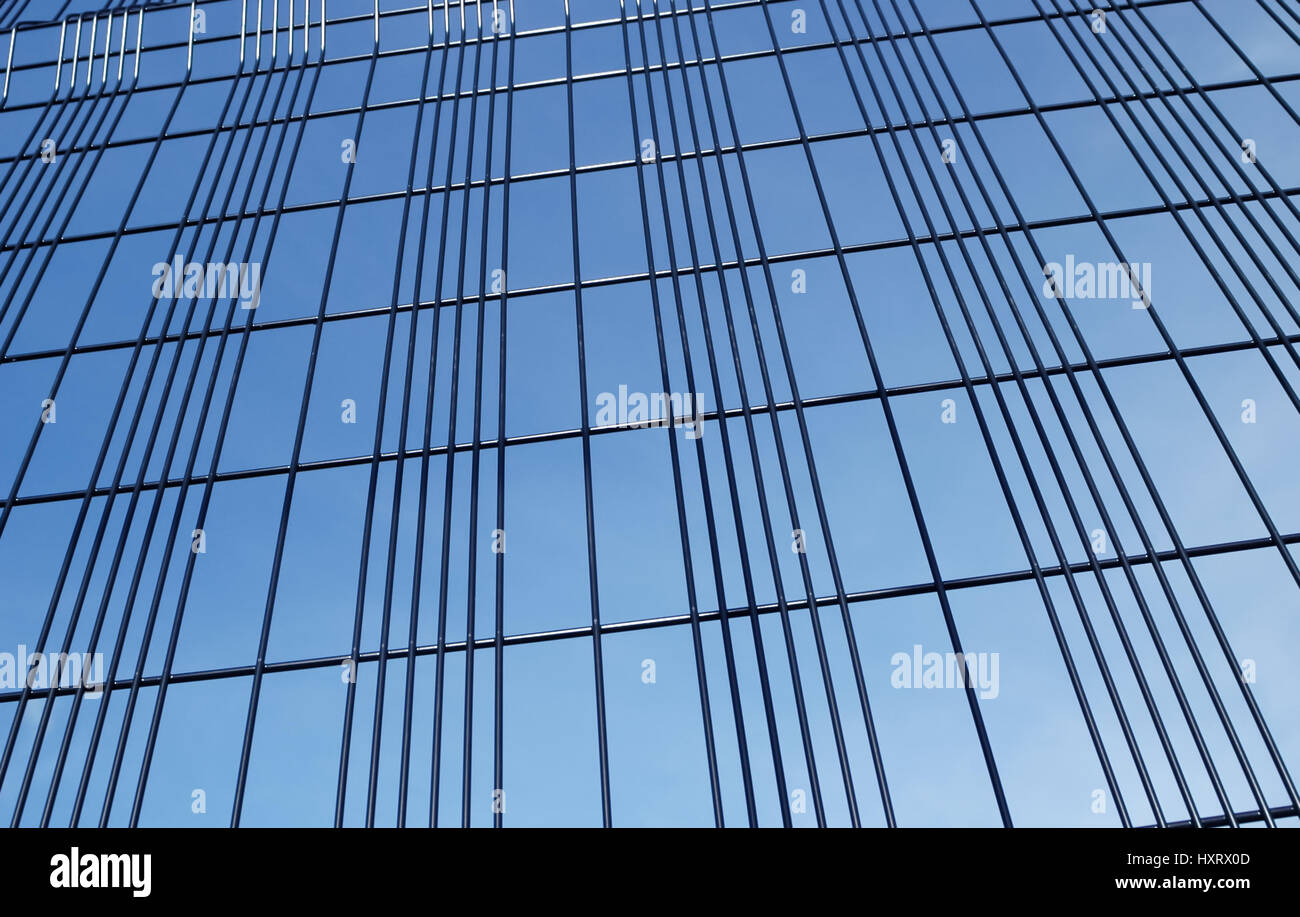 background of security fencing against blue sky Stock Photo - Alamy