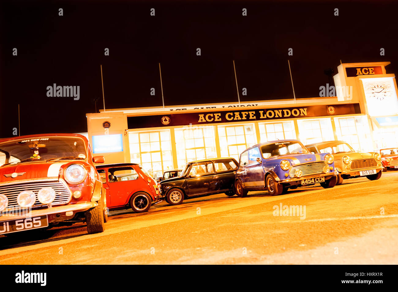 London, UK - April 4, 2013: Night exposure of a classic Austin Mini automobiles parked at the landmark Ace Cafe in London, UK Stock Photo