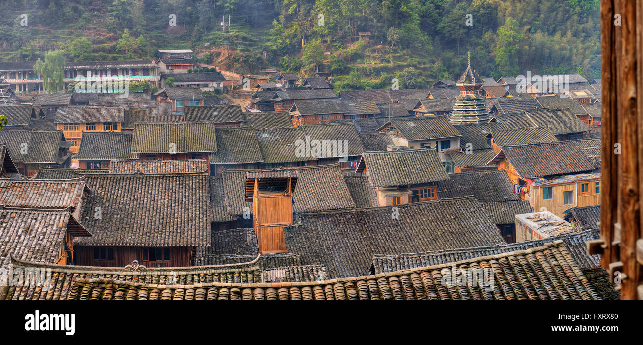 Zhaoxing Dong Village, Guizhou Province, China -  April 9, 2010:  Tile roofs farmhouses in the mountain village of ethnic minorities in southwest Chin Stock Photo