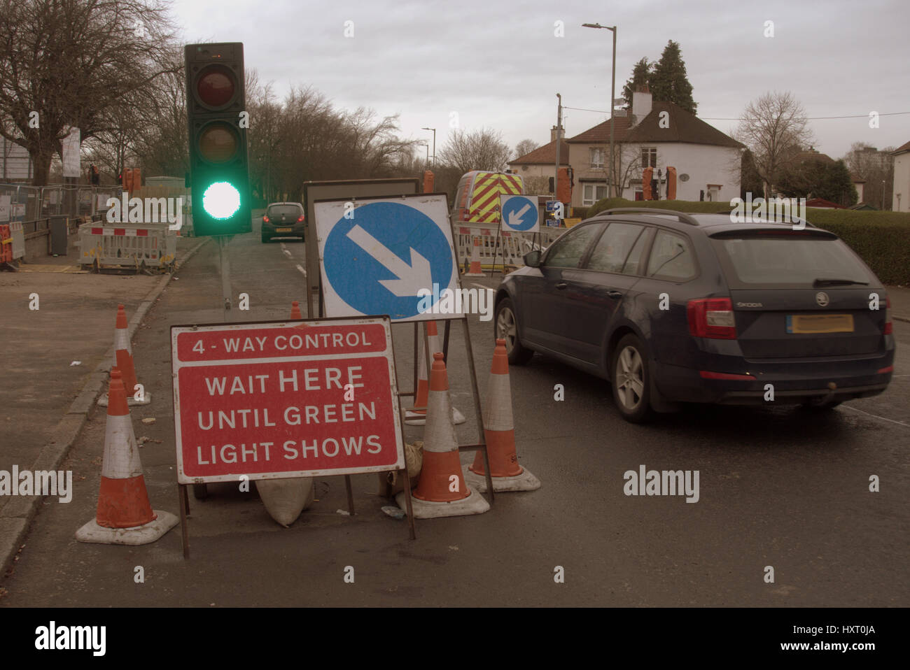 temporary traffic lights on green Stock Photo