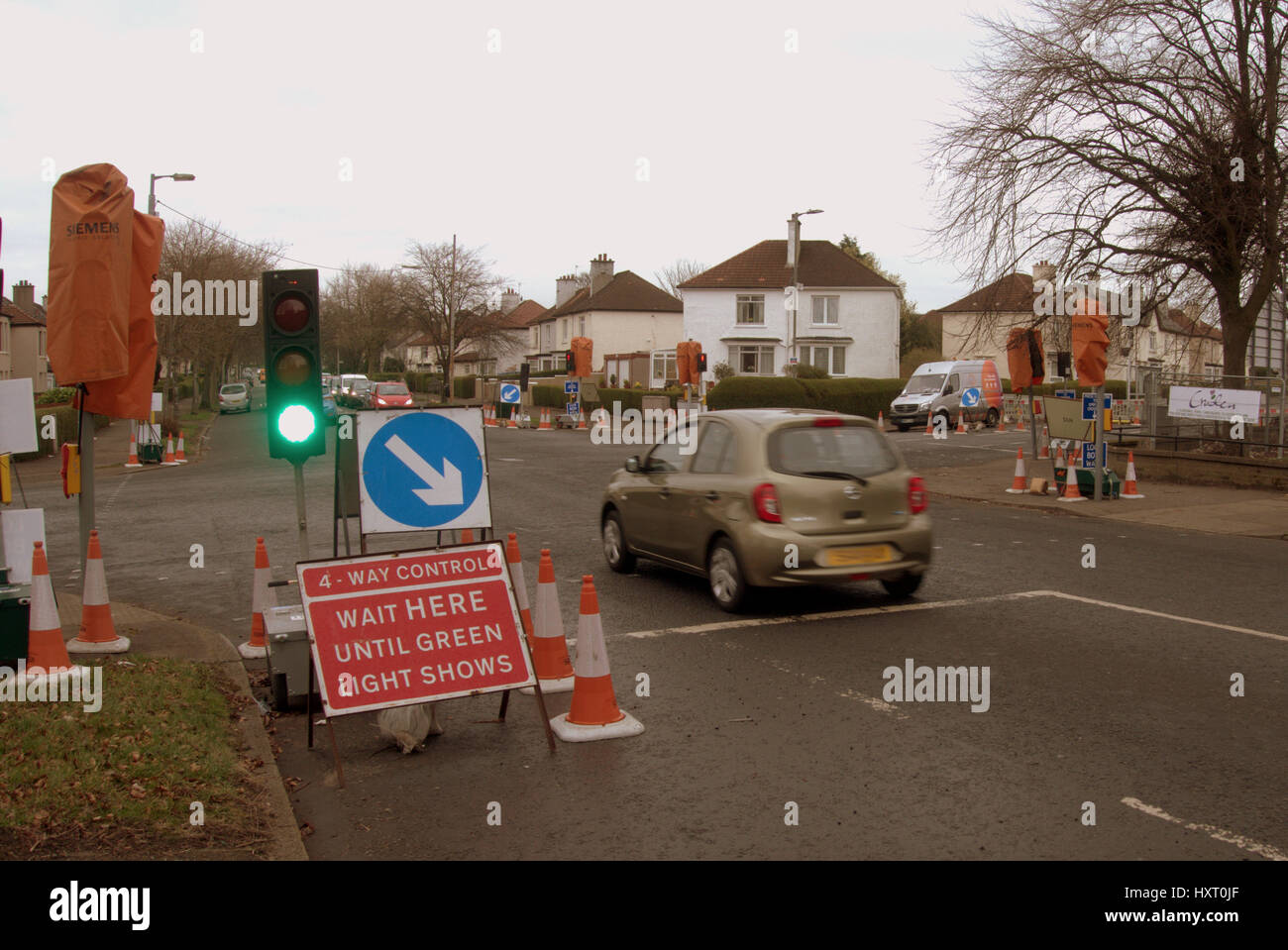 temporary traffic lights on green Stock Photo