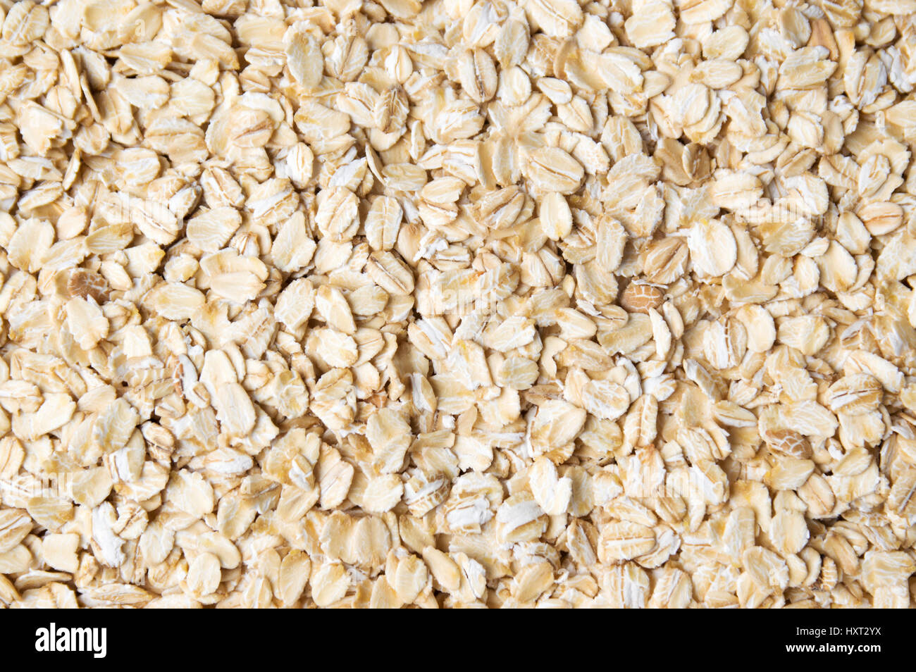 Bunch of oat flakes forming a background pattern Stock Photo
