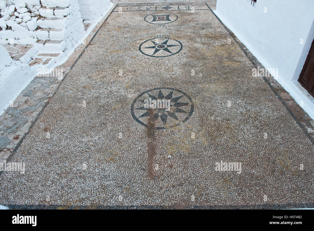 Boden aus weiß-schwarzem Kieselmosaik auf der Burg, Kastro, Insel Kastellorizo, Dodekanes, Griechenland Stock Photo