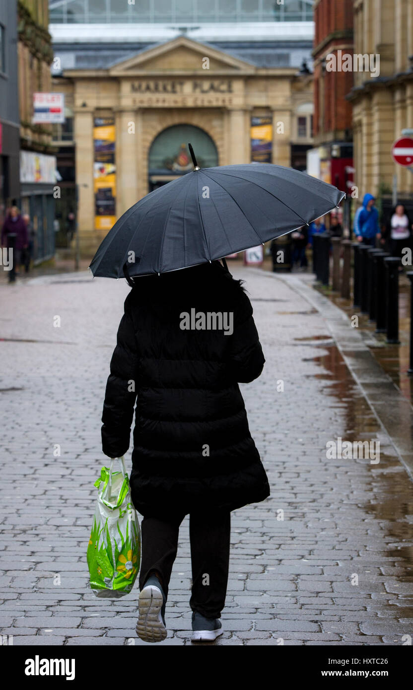 Bolton, UK. 30th March 2017. Wet morning for shoppers in Bolton, Lancashire as other parts of the country are expected to have the hottest day of the year so far. Picture by Paul Heyes, Thursday March 30, 2017. Credit: Paul Heyes/Alamy Live News Stock Photo