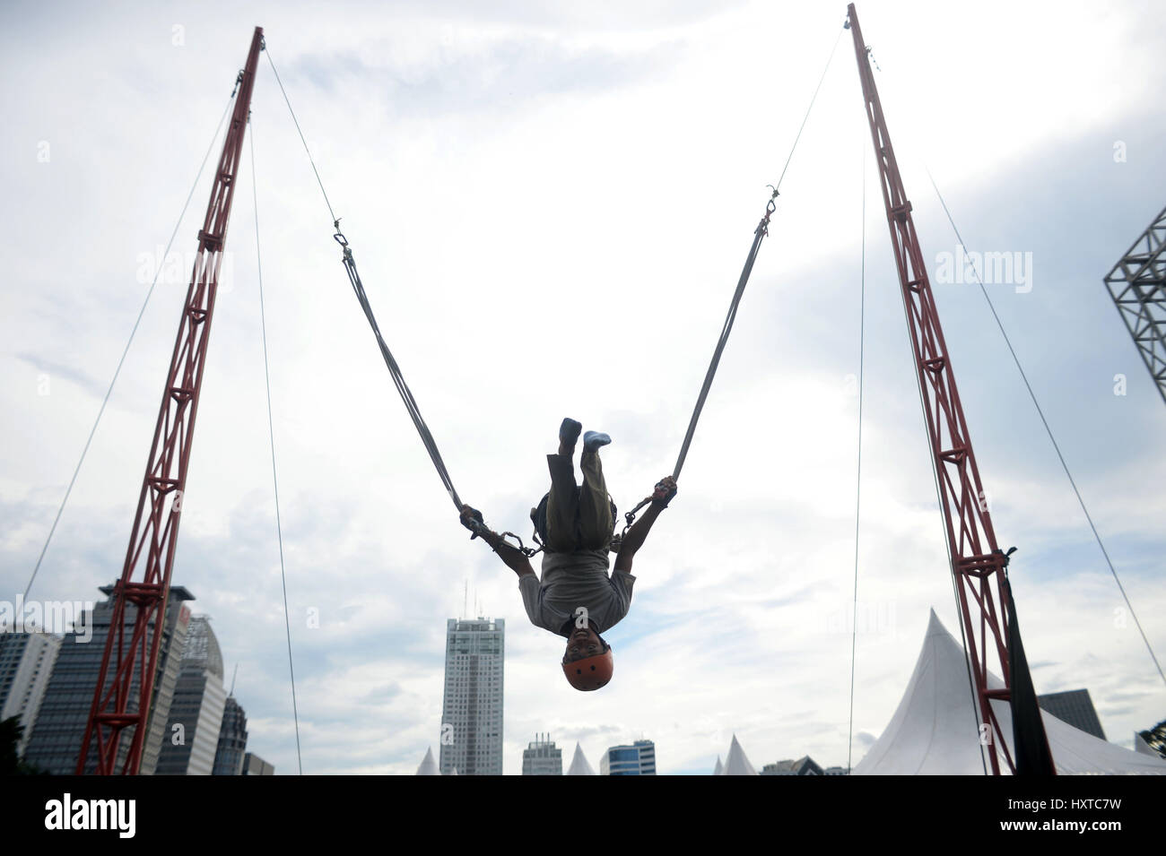 Jakarta, Indonesia. 30th Mar, 2017. A man tries bungee jumping during