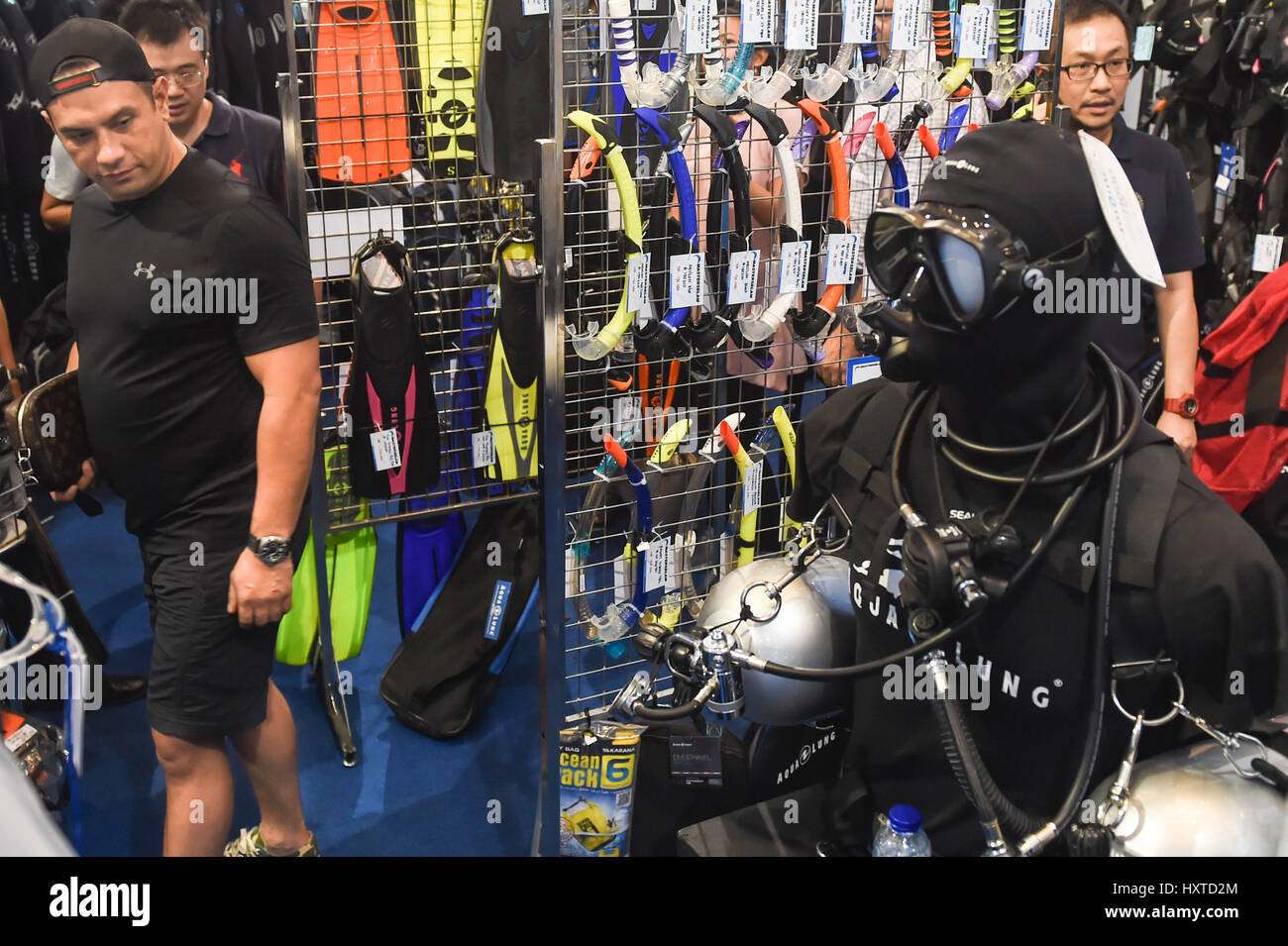 Jakarta. 30th Mar, 2017. People choose dive equipment during the Deep and Extreme Indonesia 2017 in Jakarta, Indonesia on March 30, 2017. The exhibition, which attracts 140 exhibitors, lasts four days. Credit: Du Yu/Xinhua/Alamy Live News Stock Photo