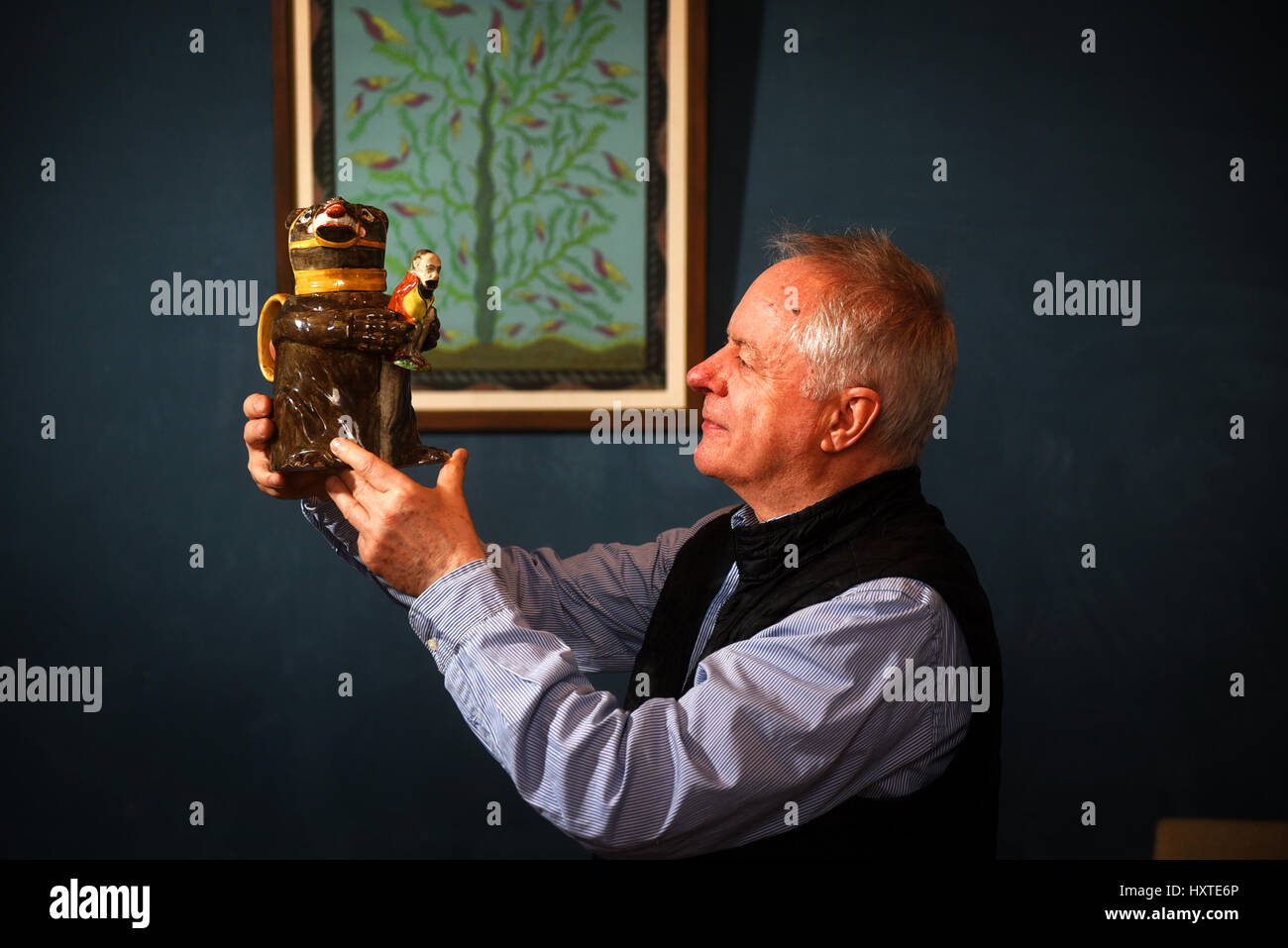 Oxford, UK. 29th Mar, 2017. Antique dealers setting up for The Cotswolds Art and Antiques Dealers' Association (CADA) Fair, which runs over the weekend, 30th March - 2nd April at Blenheim Palace, Woodstock, Oxfordshire, UK. John Howard with a porcelain figure of a Russian Bear clutching Napoleon. Picture by Richard Cave 29.03.17 Credit: Richard Cave/Alamy Live News Stock Photo