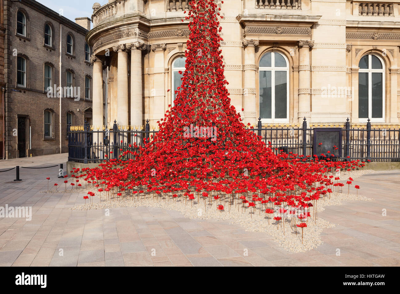 Hull, East Yorkshire, UK. 30th March 2017. Poppies: Weeping Window by Paul Cummins artist and Tom Piper designer. A cascade of several thousand handmade ceramic poppies installed at Hull’s Maritime Museum. Credit: LEE BEEL/Alamy Live News Stock Photo