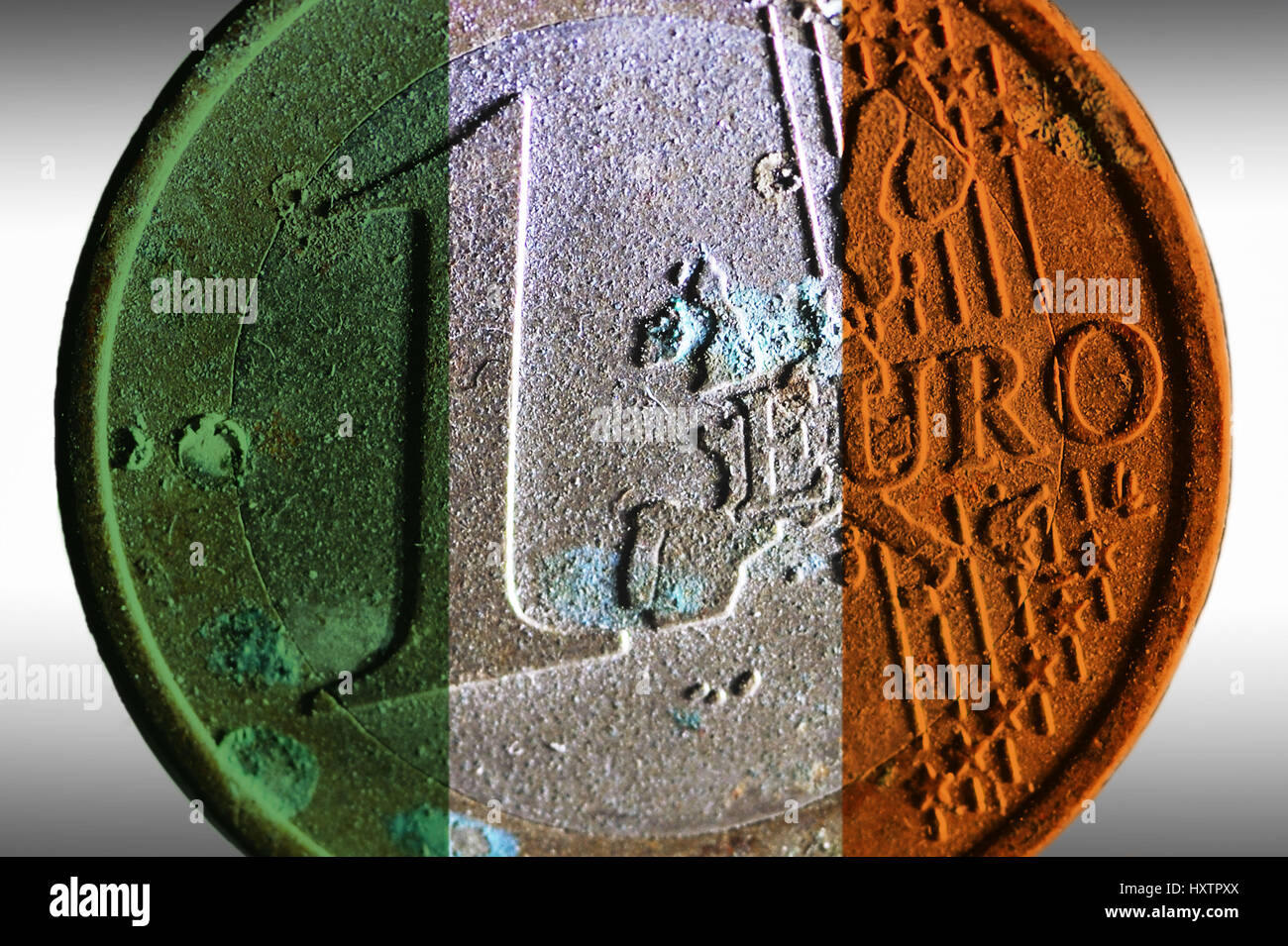 Old euro-coin one in the national colours of Ireland, state deficit Ireland, Alte Ein-Euro-Münze in den Nationalfarben von Irland, Staatsdefizit Irlan Stock Photo