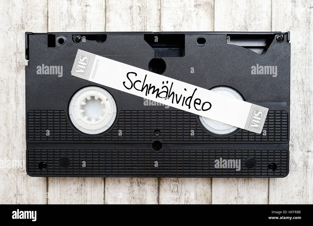 Video tape with stroke abusive video, Videokassette mit Schriftzug Schmähvideo Stock Photo