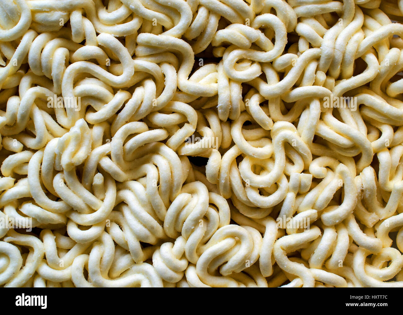 Raw and dry Instant Ramen noodles- food texture or background Stock Photo -  Alamy