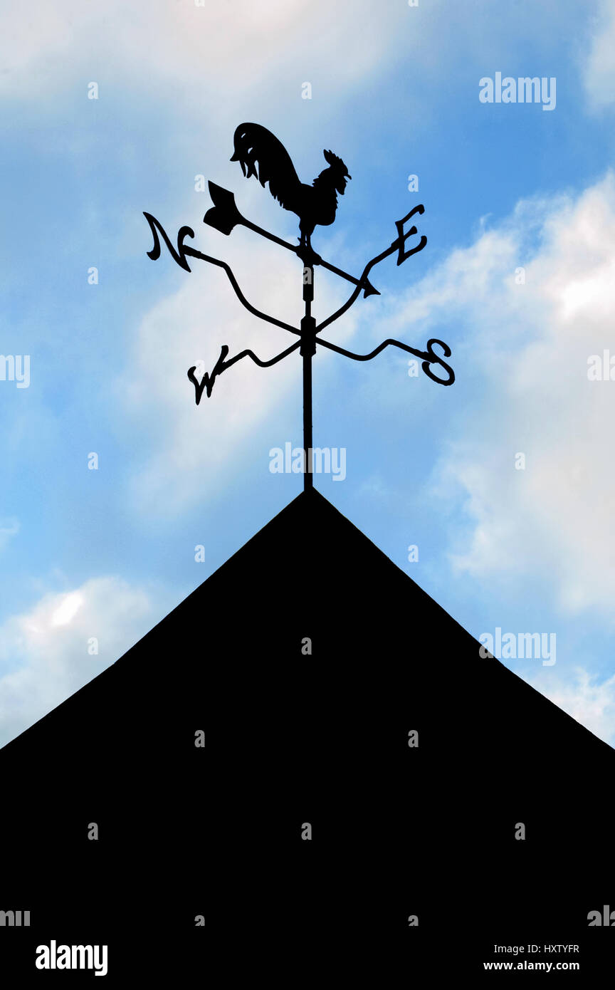 silhouette of a weather vane wind direction indicator Stock Photo Alamy