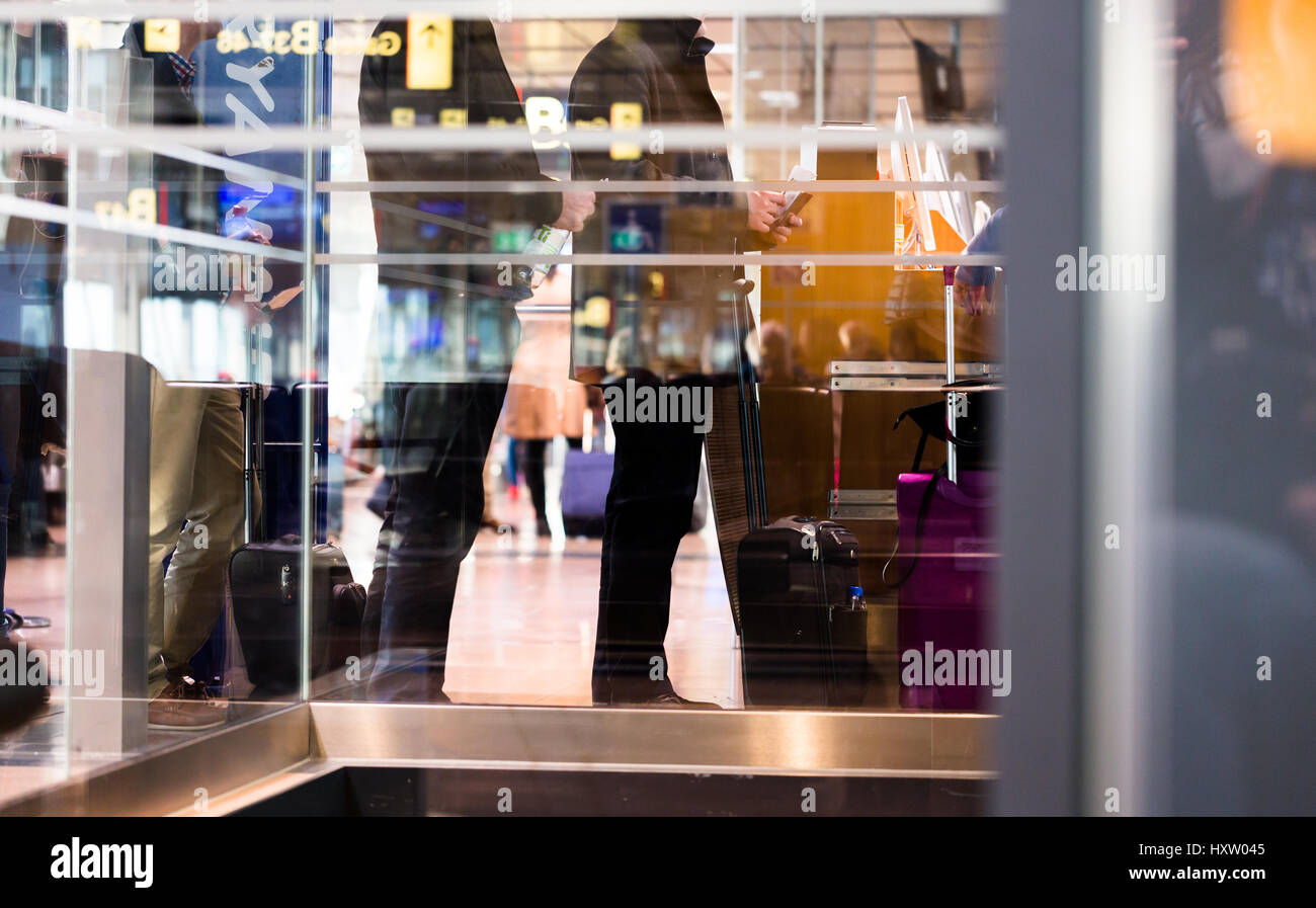 People in queue line waiting at airport gate for check-in to get the ...