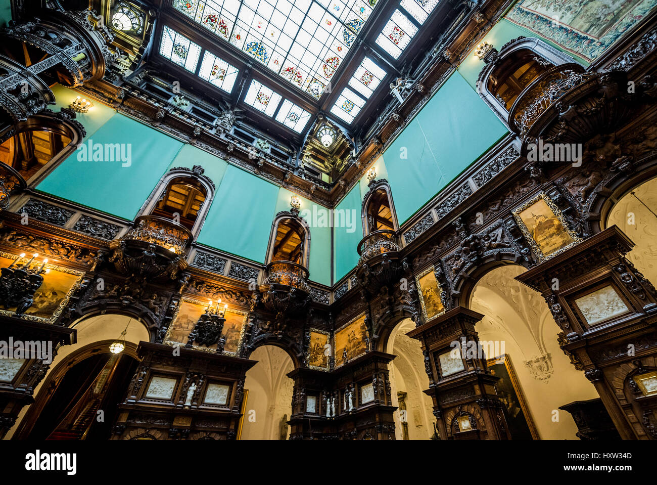 Hall of Honour (Holul de Onoare) and glass ceiling in Peles Palace, former royal castle, built between 1873 and 1914, located near Sinaia in Romania Stock Photo