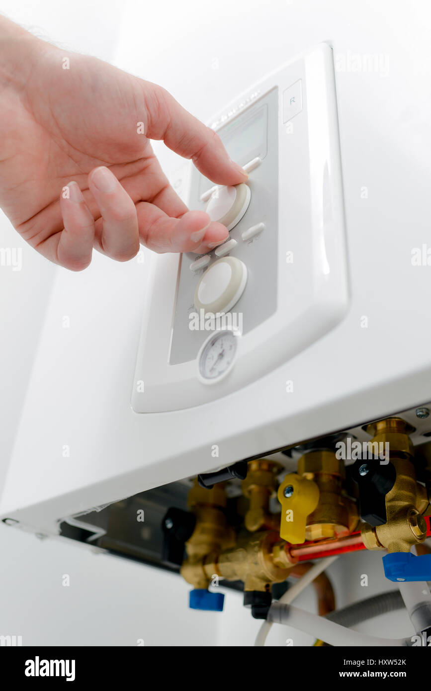 person adjusting a machine Stock Photo - Alamy