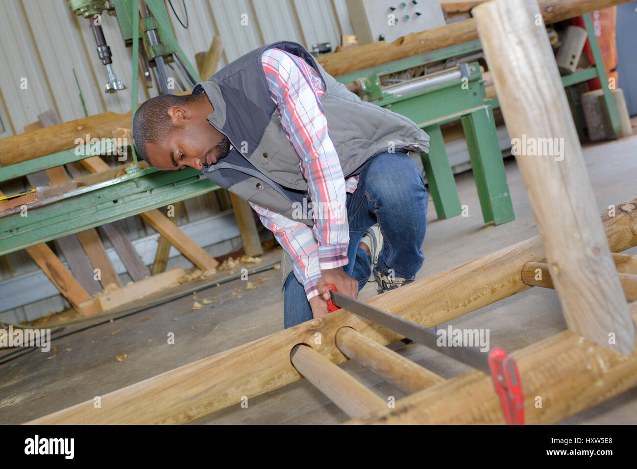 Man working in woodyard Stock Photo Alamy