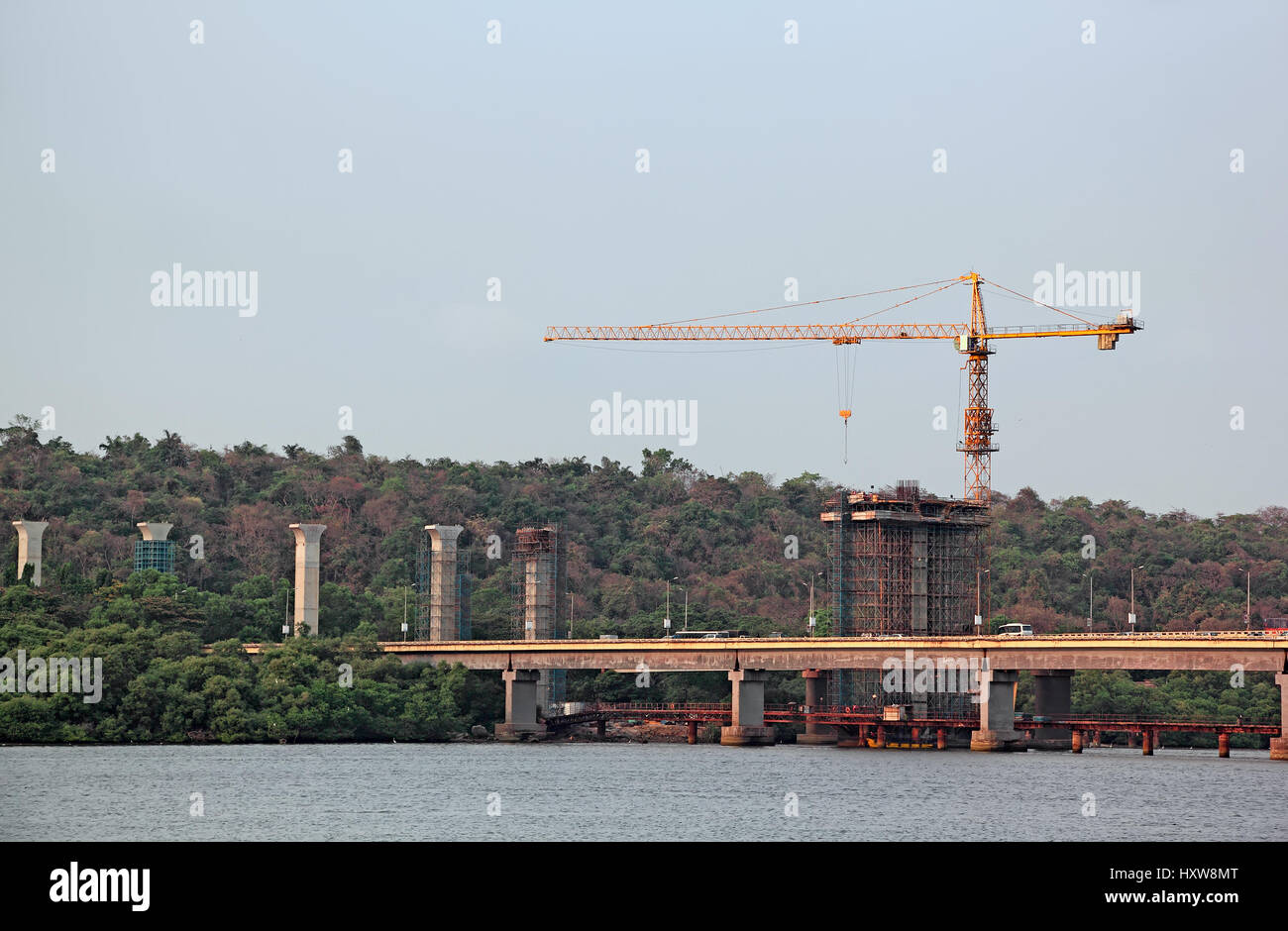 Construction of tall concrete piers using tower crane for new bridge