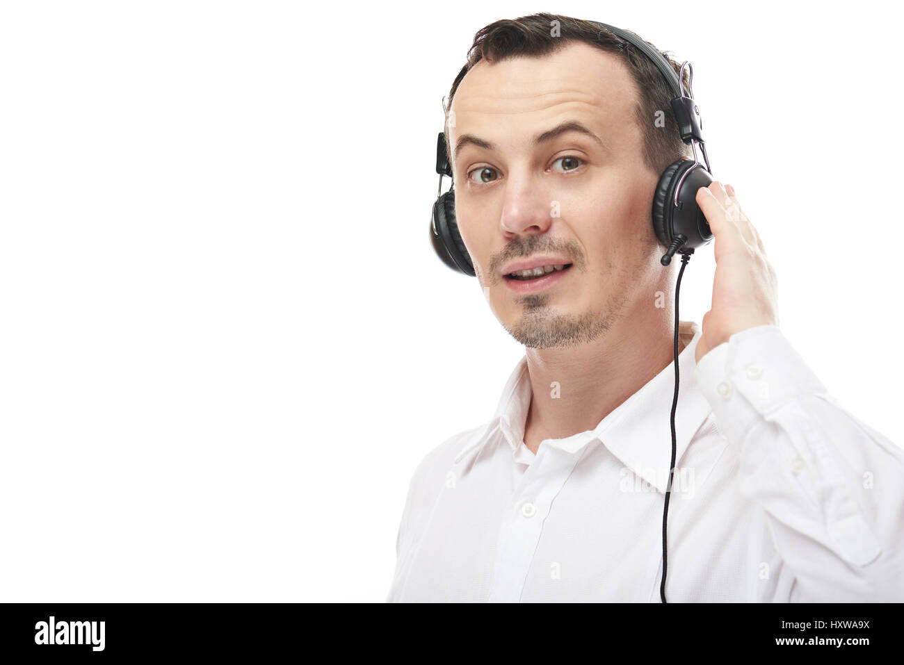 Online support call service. Young man with headset talk on phone Stock Photo