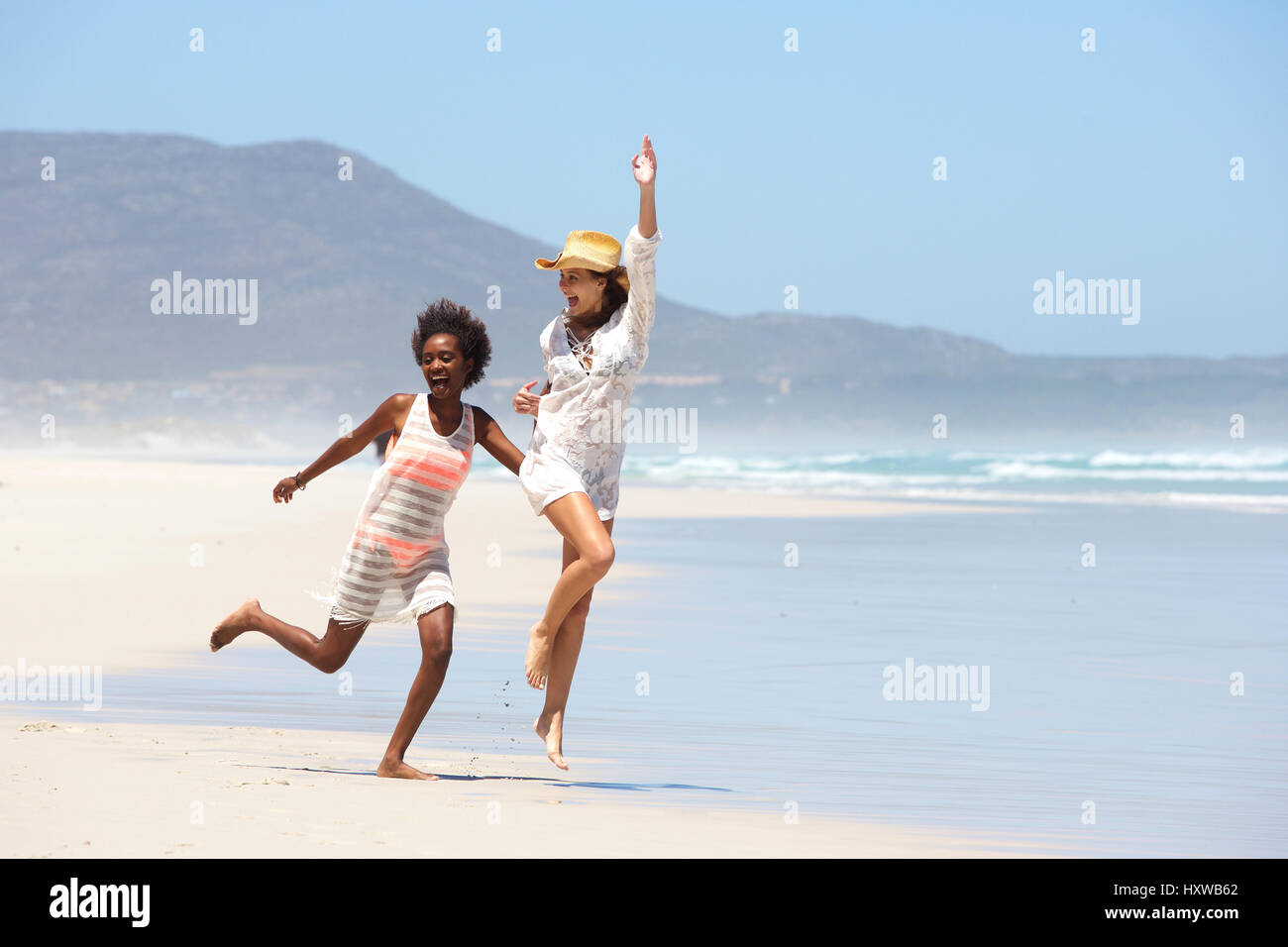 Walking barefoot on beach hi-res stock photography and images - Alamy