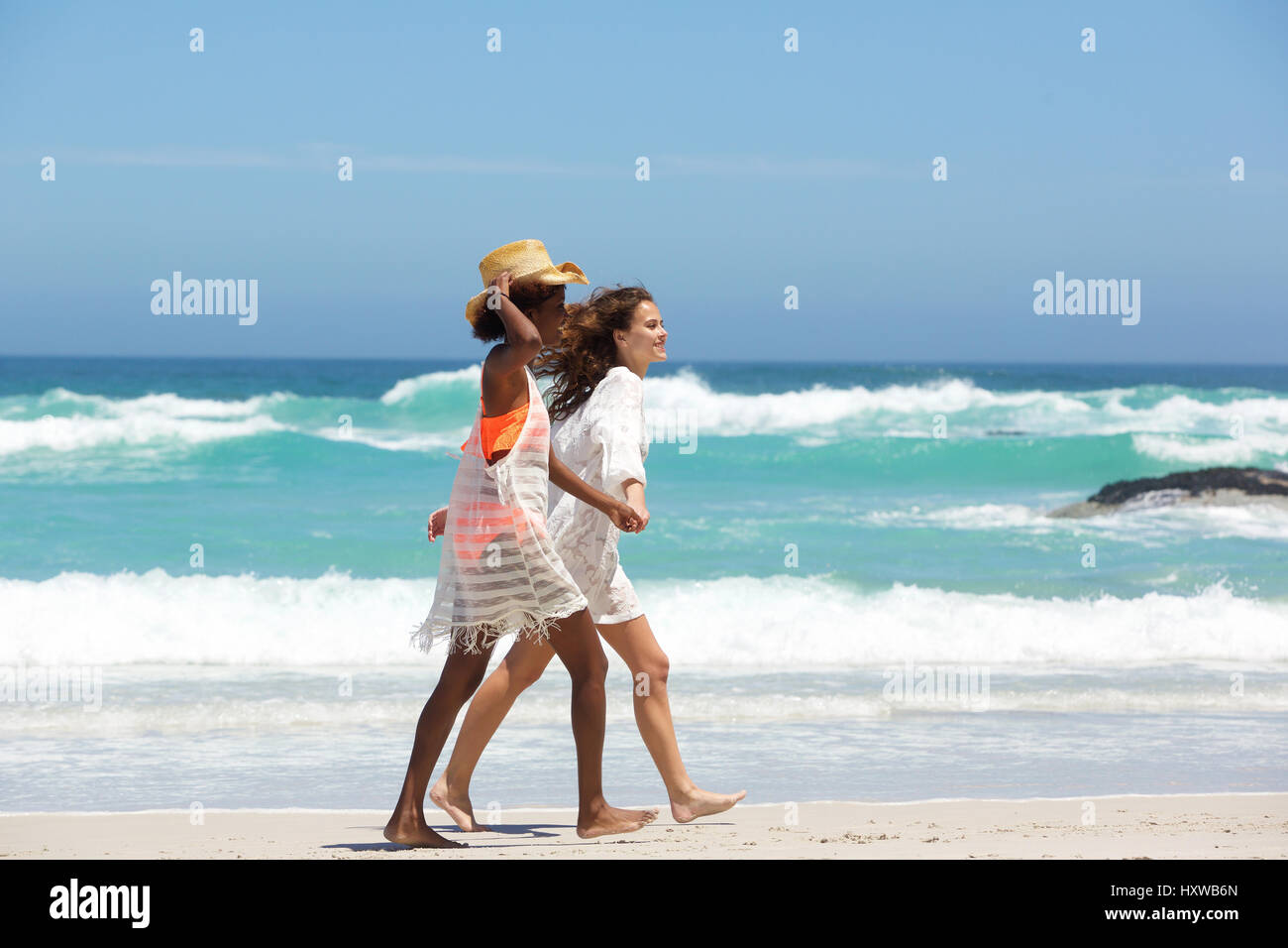 Two women walking side by side hi-res stock photography and images - Alamy
