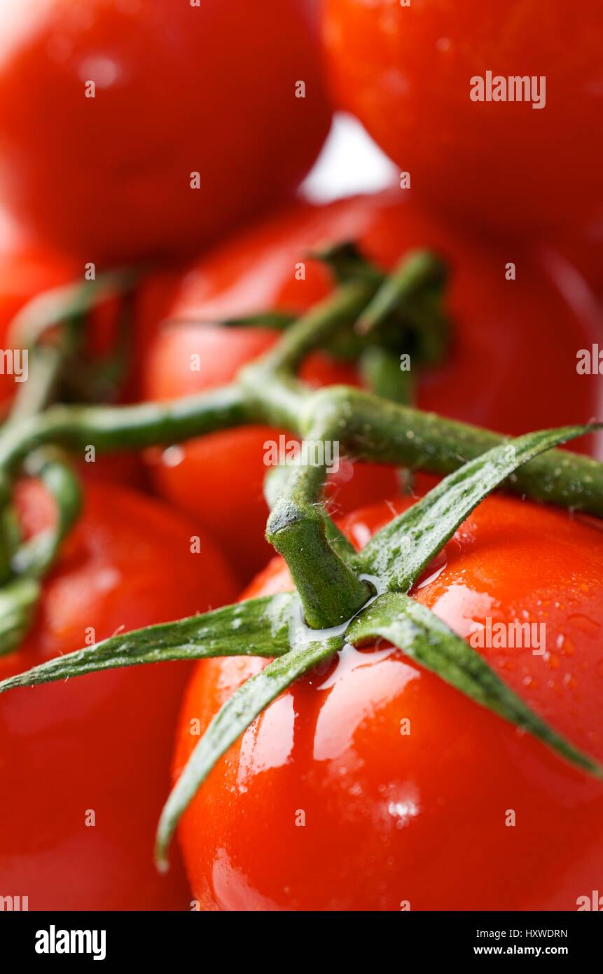 forefront of a group of red tomatoes Stock Photo - Alamy