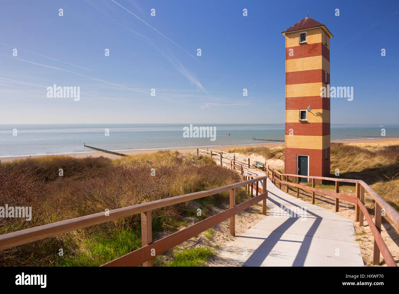 The lighthouse in the dunes at Dishoek in Zeeland, The Netherlands. Stock Photo