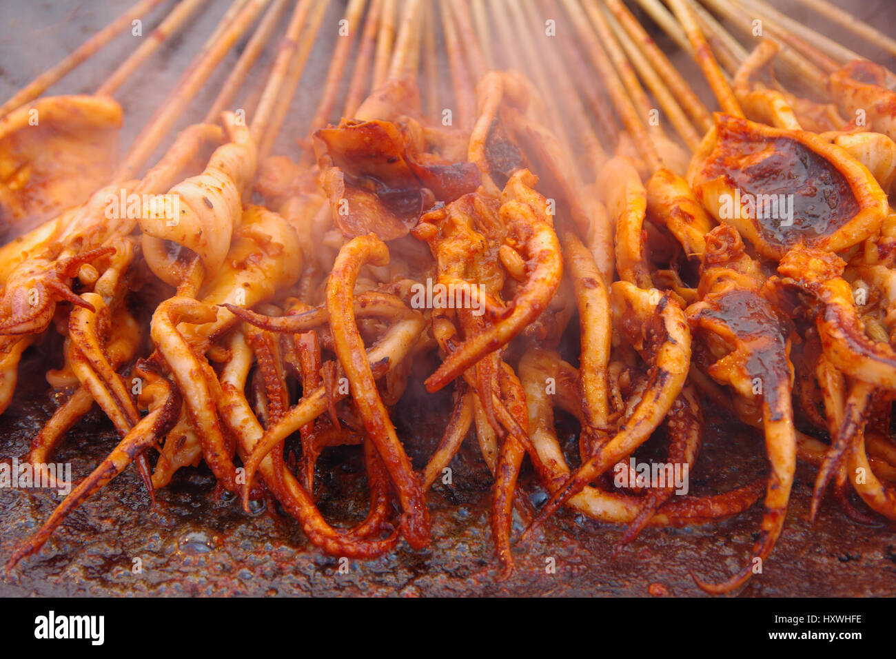 Sizzling squid Stock Photo