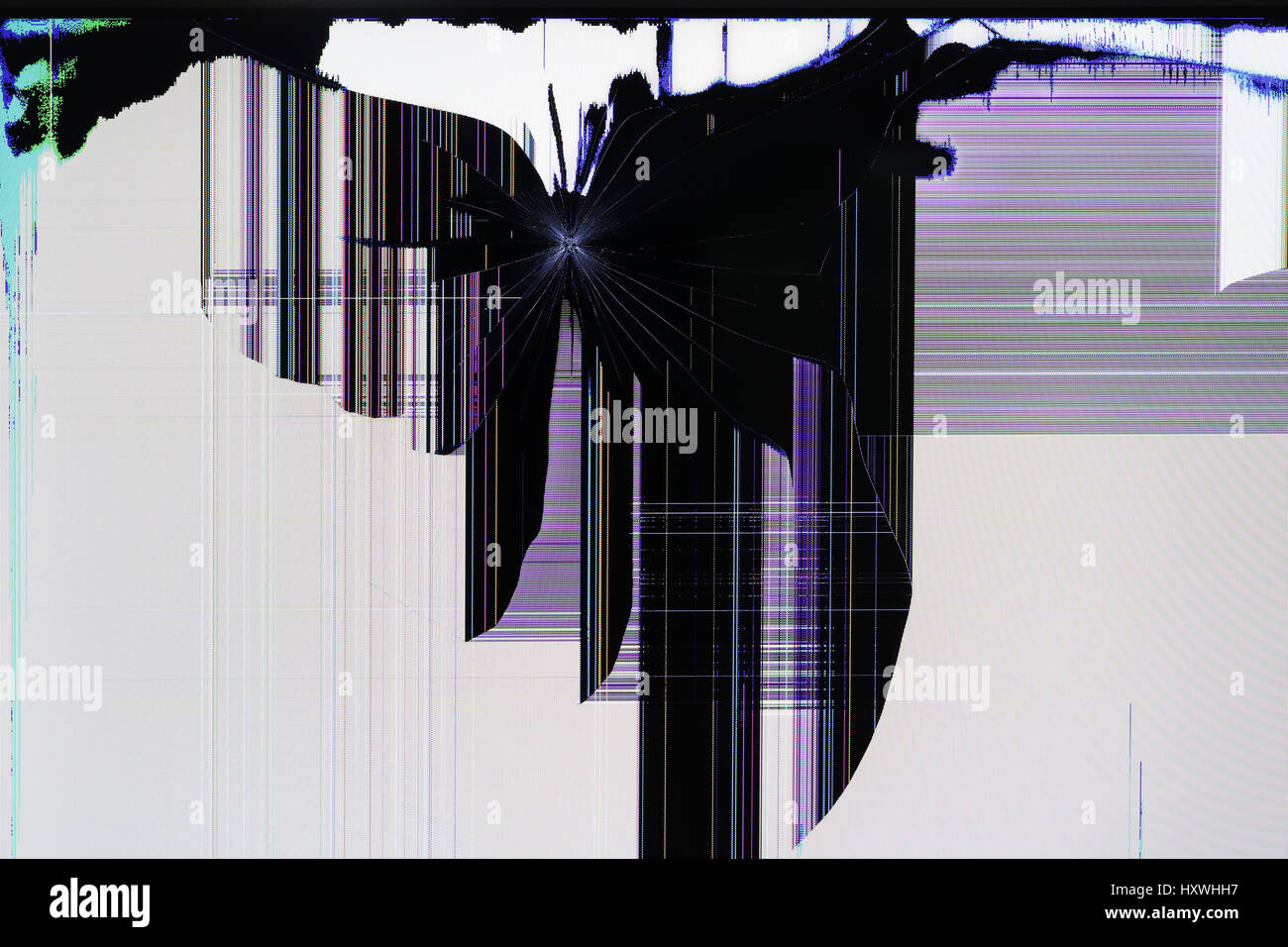 The LCD screen of the tv setis broken by shots from the traumatic gun. Color strips and pixels the abstract background Stock Photo