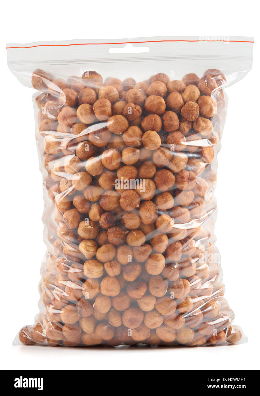 Hazelnuts in plastic zipper bag isolated on white Stock Photo