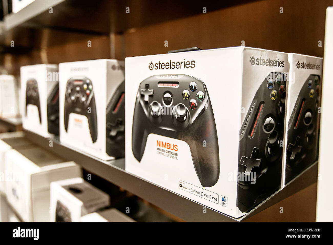 Nimbus - a wireless controller - is offered for sale in an Apple store. Stock Photo