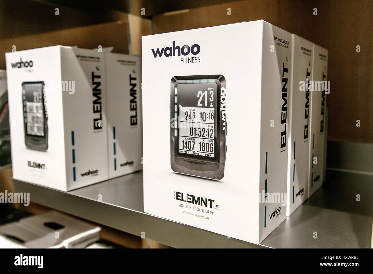 ELEMNT GPS Bike Computer by Wahoo Fitness is offered for sale in an Apple store. Stock Photo