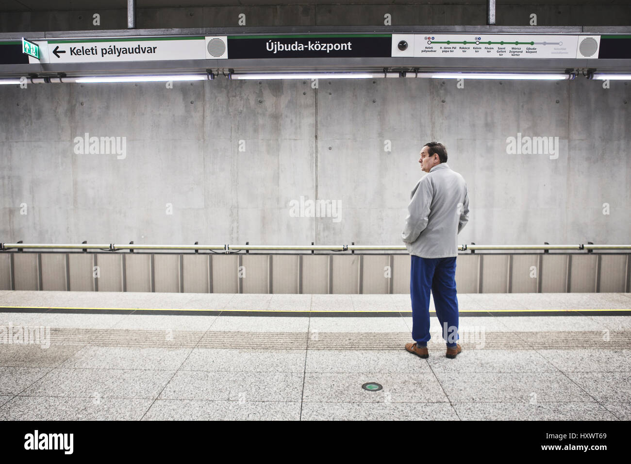 Man waiting for the Metro in Budapest, Hungary.  Budapesti Metro is the oldest electrified underground railway system on the European Continent and th Stock Photo