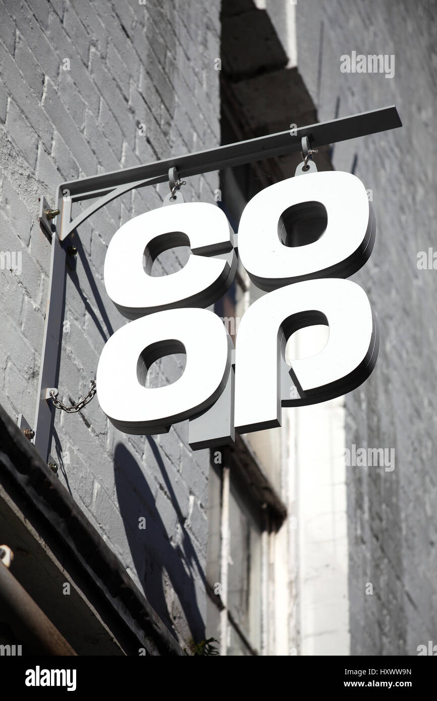 Carmarthen, UK, October 22, 2016 :  Co Op logo advertising sign outside one of its its retail supermarket stores in the city centre Stock Photo