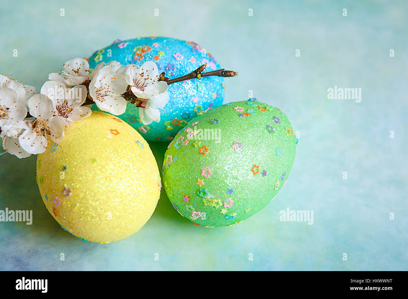 colorful easter eggs and branch with flowers Stock Photo - Alamy