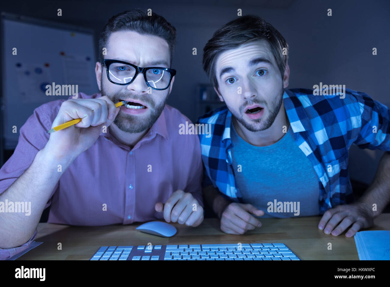 Smart nervous hackers working together Stock Photo