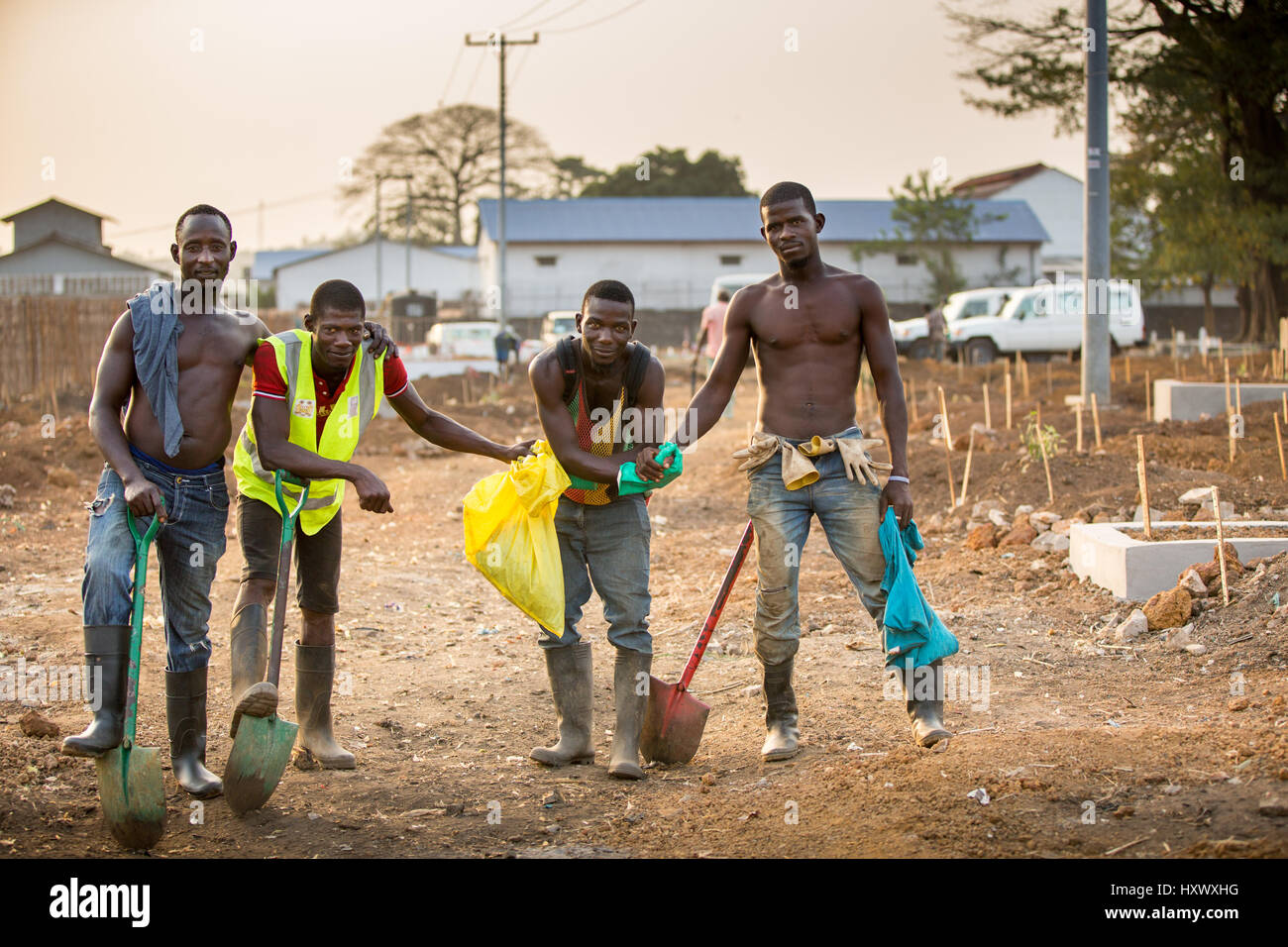 This team of gravediggers work hard to keep up with demand for burials in Freetown, Sierra Leone. Bonded in tough times. Stock Photo