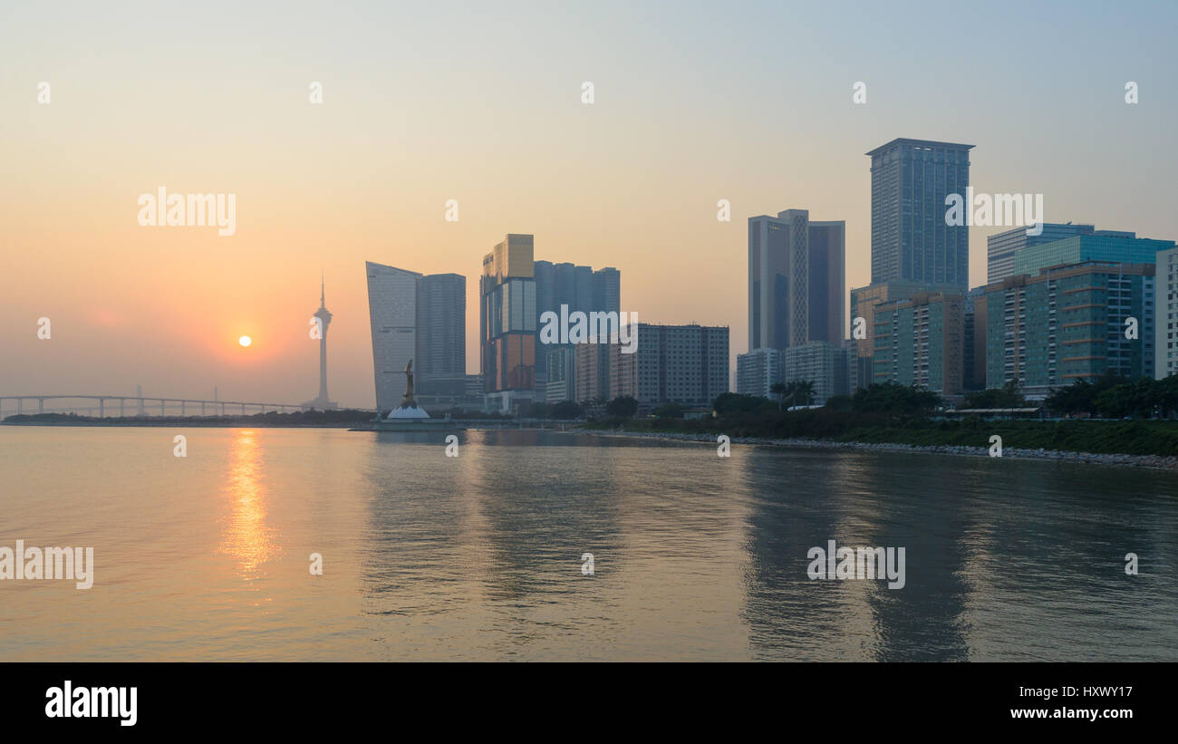 Macau, China - Jan 8, 2013: Skyline of macau city at outer harbour before sunset. The city maintains the world's highest gambling revenue Stock Photo