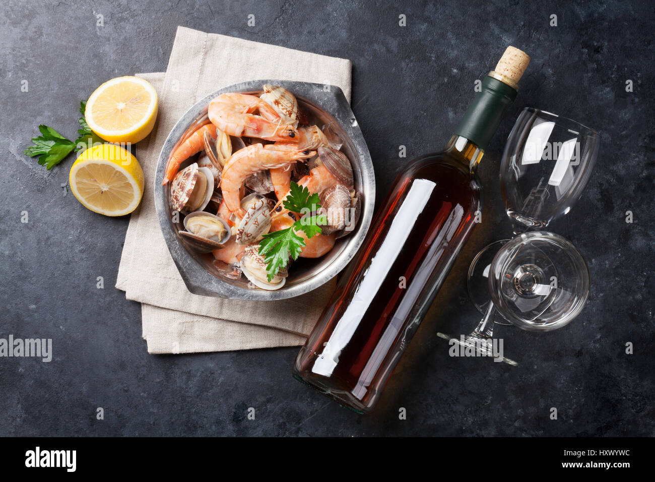 Fresh seafood and white wine on stone table. Top view Stock Photo - Alamy