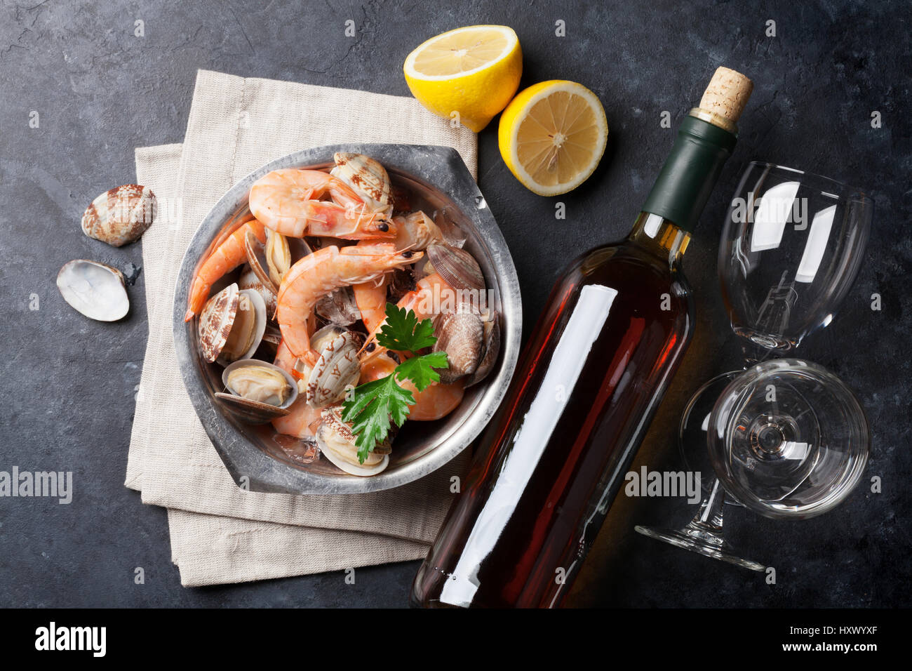 Fresh seafood and white wine on stone table. Top view Stock Photo - Alamy